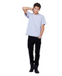 Serious young guy looking at you with his hand in his hair - ful