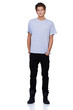 Serious young guy looking at you with his hands in his pockets