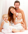 Happy young family. Indoors.