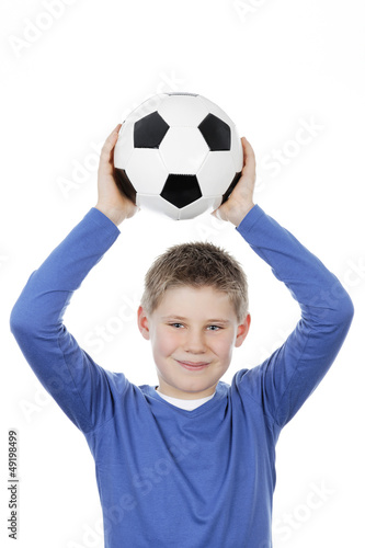 Photo: boy holding a football ball boy holding a football ball
