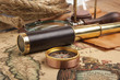 Photo: Brass telescope on map Brass telescope on map