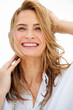 Photo: Closeup of a happy blonde female in a white shirt smiling and to Closeup of a happy blonde female in a white shirt smiling and to