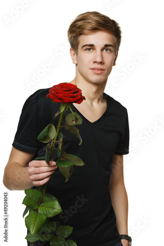 Photo: Young hansome man giving you red rose Young hansome man giving you red rose