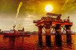 Photo: Oil rig in the dramatic scenery. Oil rig in the dramatic scenery.