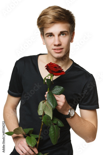 Photo: Young hansome man holding the red rose Young hansome man holding the red rose