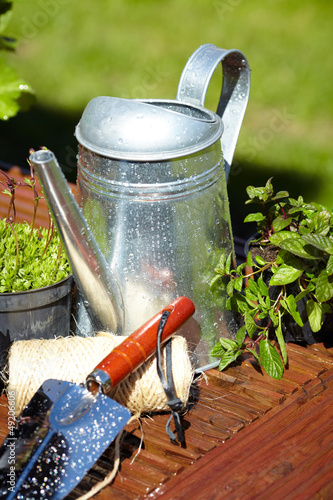Photo: Outdoor gardening tools and flowers Outdoor gardening tools and flowers