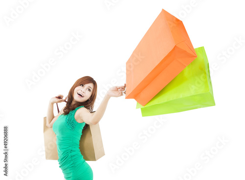 Photo: happy young woman holding shopping bag happy young woman holding shopping bag