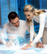 man and woman working with virtual screen