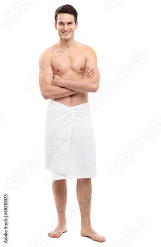 Photo: Young man wearing towel Young man wearing towel