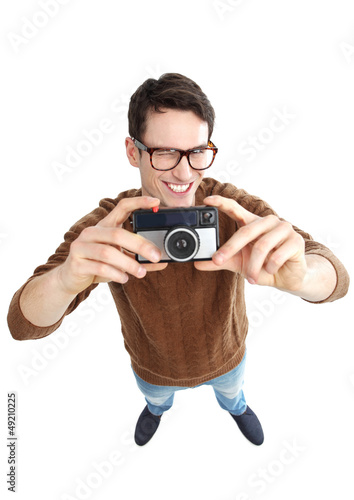 Photo: Geeky man with vintage camera Geeky man with vintage camera