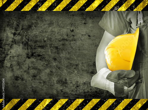 Photo: Worker and grunge texture in background Worker and grunge texture in background