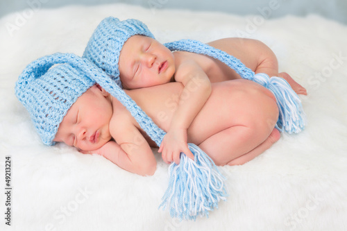 Photo: Twins in blue hats Twins in blue hats