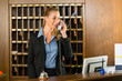 Reception of hotel - desk clerk taking a call