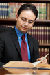 Young lawyer reading a book