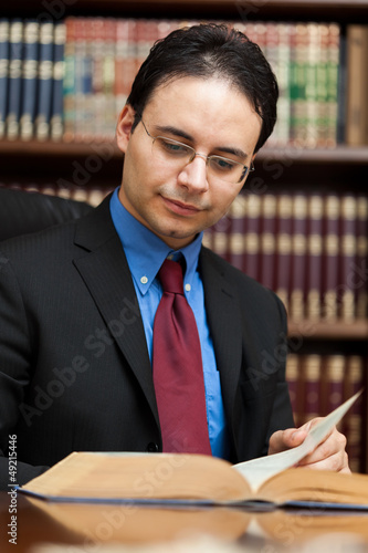 Photo: Young lawyer reading a book Young lawyer reading a book