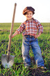 Smiling boy with shovel