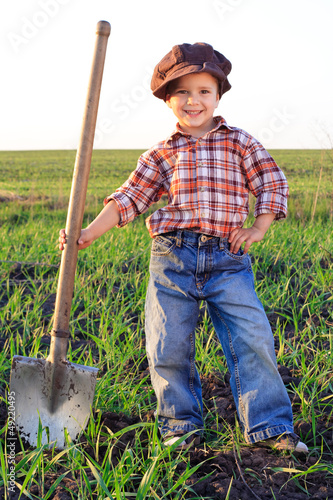 Photo: Smiling boy with shovel Smiling boy with shovel