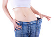 Foto: Slim woman shows her weight loss by wearing an old jeans Slim woman shows her weight loss by wearing an old jeans