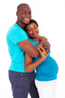 happy african american expecting couple isolated on white