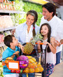 Happy family at the supermarket