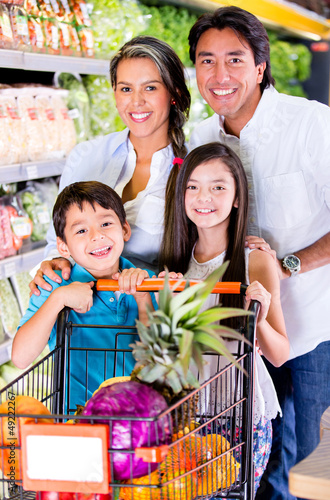 Photo: Happy family at the grocery store Happy family at the grocery store