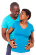 happy african young couple expecting baby
