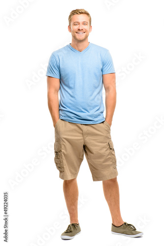 Photo: Handsome young man smiling full length white background Handsome young man smiling full length white background