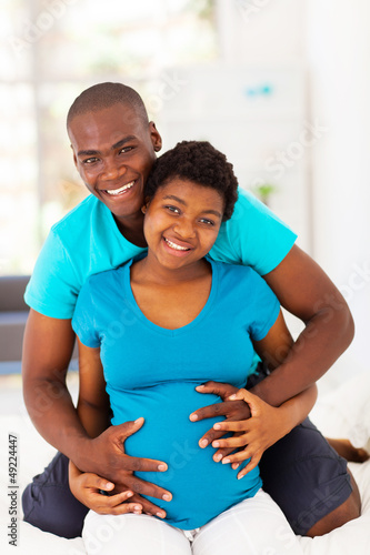 Photo: happy african american couple expecting baby happy african american couple expecting baby