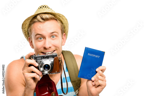 Photo: Happy young tourist man holding passport retro camera white back Happy young tourist man holding passport retro camera white back