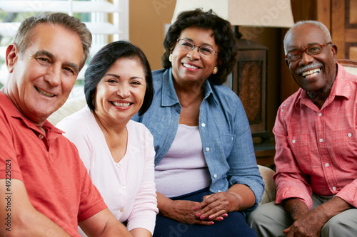 Photo: Portrait Of Senior Friends At Home Together Portrait Of Senior Friends At Home Together