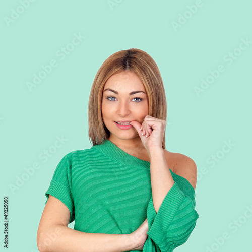 Photo: Nervous woman eating her nails Nervous woman eating her nails