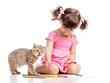 painting child girl with playful kitten