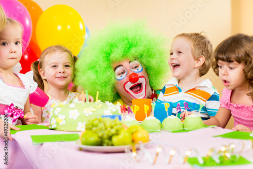 Photo: kids celebrating birthday party with clown kids celebrating birthday party with clown
