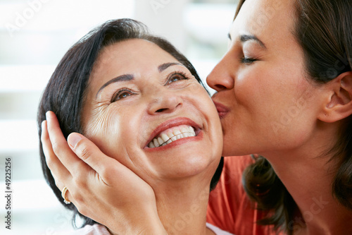 Photo: Portrait Of Adult Daughter Kissing Mother Portrait Of Adult Daughter Kissing Mother