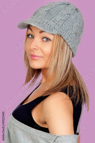 Photo: Attractive woman with a grey wool bonnet Attractive woman with a grey wool bonnet