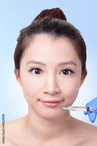Photo: woman gets Cosmetic injection in lips woman gets Cosmetic injection in lips