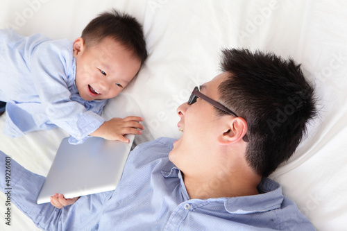 Photo: happy family using tablet pc happy family using tablet pc
