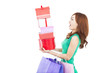 surprised young woman holding gift box and shopping bag