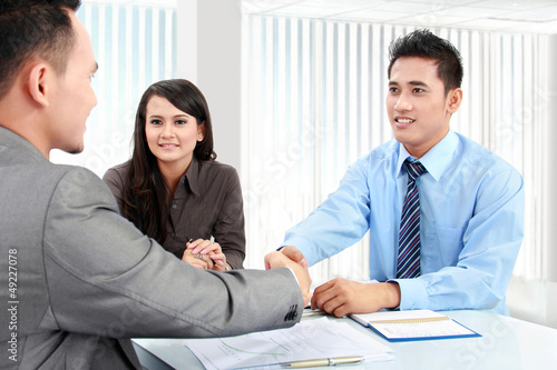 Photo: business team making a deal business team making a deal
