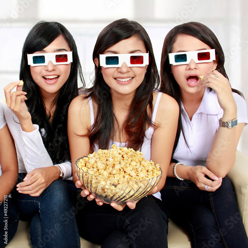 Photo: girl friends watching movie in 3d girl friends watching movie in 3d