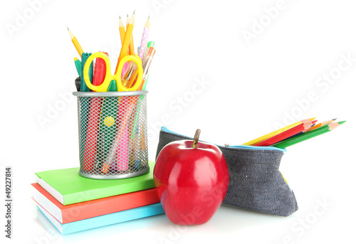 Photo: pencil box with school equipment and apple isolated on white pencil box with school equipment and apple isolated on white