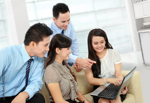 Photo: group of business people meeting with laptop group of business people meeting with laptop