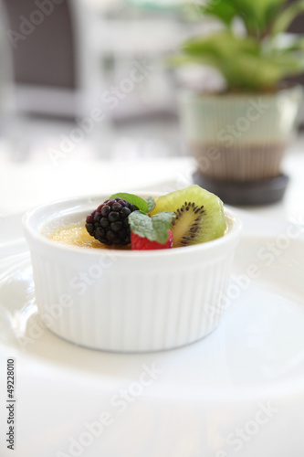 Photo: Creme brulee. Traditional French vanilla cream dessert with frui Creme brulee. Traditional French vanilla cream dessert with frui