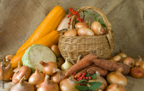 Photo: onion in basket and vegetables onion in basket and vegetables