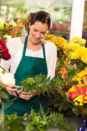 Photo: Young florist preparing flowers bouquet shop store Young florist preparing flowers bouquet shop store