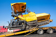 Transportation tracked paver machine during roadworks