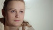 Video: Young woman is watching an interesting film on tv. Young woman is watching an interesting film on tv.