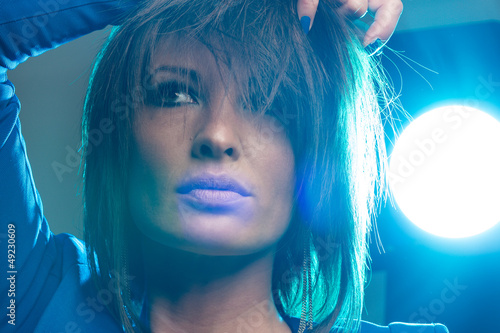 Photo: Pretty woman with blue backlight Pretty woman with blue backlight