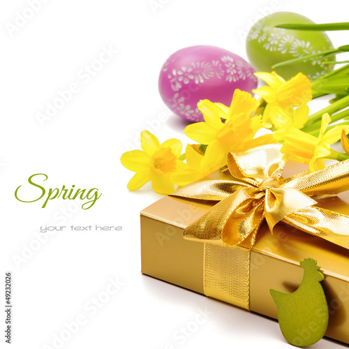 Photo: Easter setting with gift box and yellow daffodils Easter setting with gift box and yellow daffodils