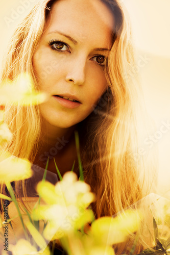 Photo: Beautiful blonde woman on grass Beautiful blonde woman on grass